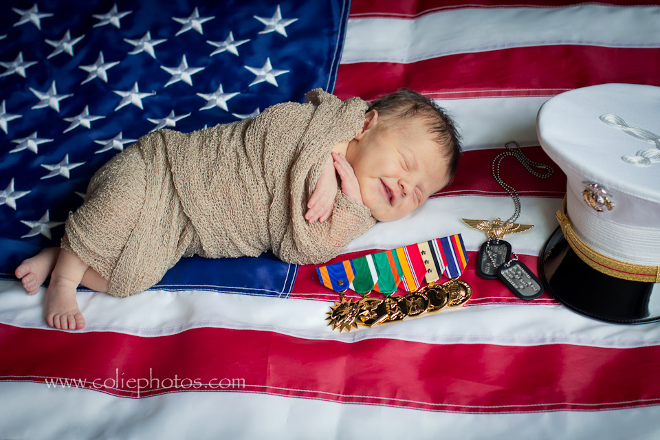 newborn smiling with US flag