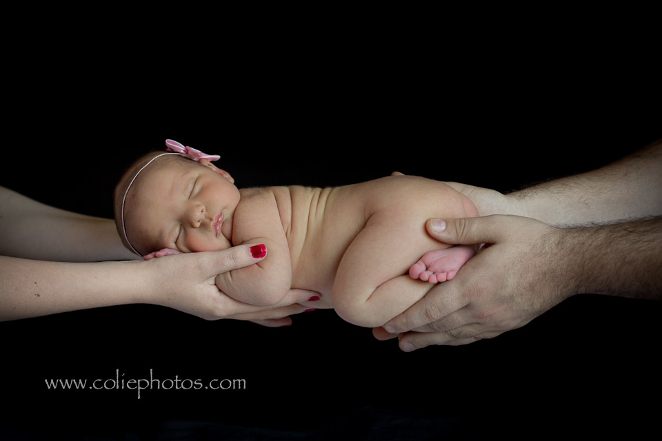 Newborn in parents hands