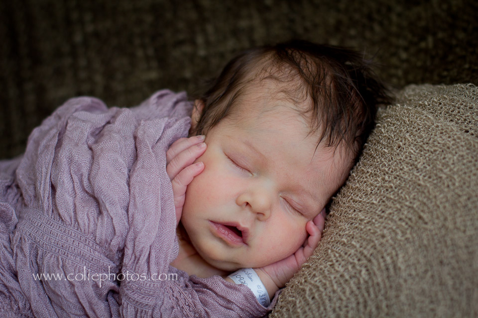 Newborn photography hands on cheeks